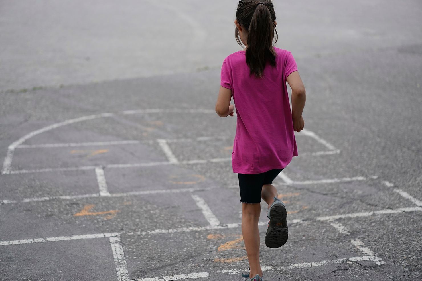 A child playing hopscotch