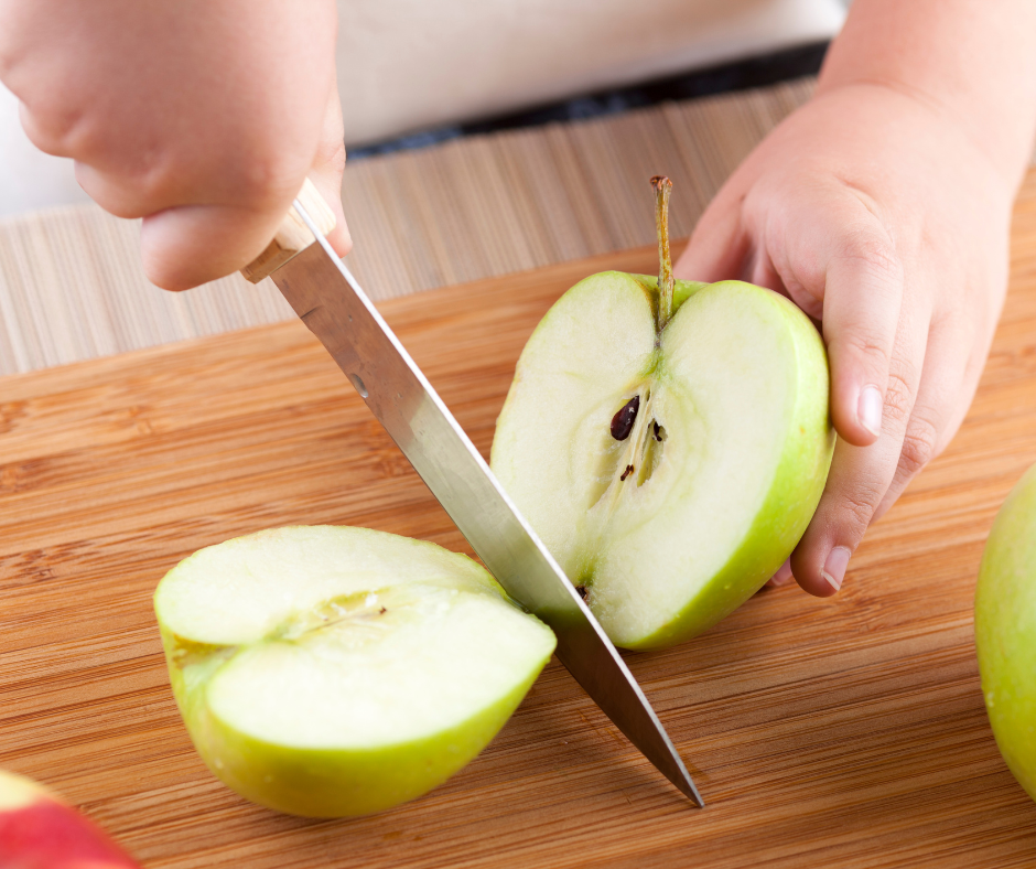 a child cuts apples in fall montessori math activities 