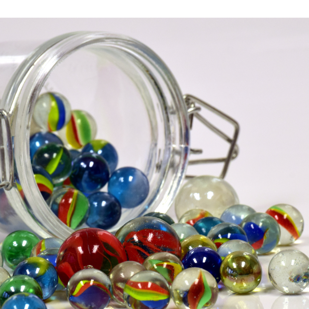 a jar of marbles, one of the materials in this estimation activity for kids