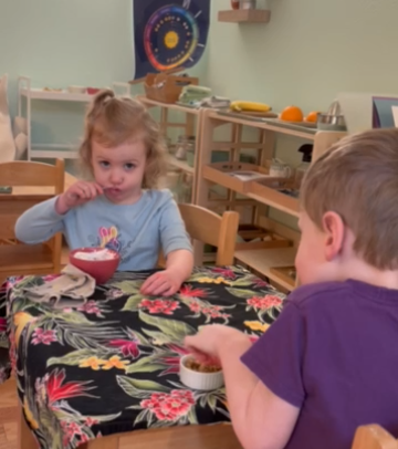 picture of child participating in snack time routine